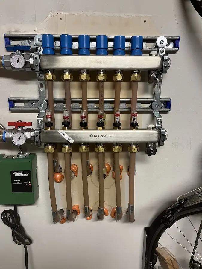 Plumber performing Water Heater Repair at a residential property in Pine Grove